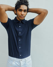 Load image into Gallery viewer, Male model is wearing navy blue Magnetic T-shirt, features magnetic buttons for easy wear. Adaptive clothing that makes dressing up easier.