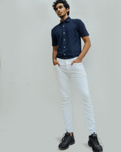 Load image into Gallery viewer, Male model is wearing navy blue Magnetic T-shirt, features magnetic buttons for easy wear. Adaptive clothing by Dawn Adaptive that makes dressing up easier.