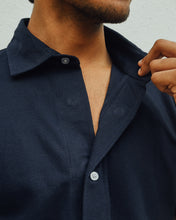 Load image into Gallery viewer, Male model is wearing navy blue Magnetic T-shirt, features magnetic buttons for easy wear. Adaptive clothing by Dawn Adaptive that makes dressing up easier.
