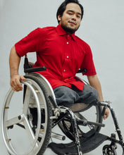 Load image into Gallery viewer, Male model in wheelchair is wearing red Magnetic T-shirt, features magnetic buttons for easy wear. Adaptive clothing by Dawn Adaptive that makes dressing up easier.