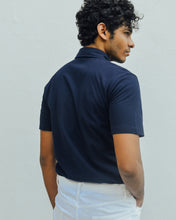 Load image into Gallery viewer, Male model is wearing navy blue Magnetic T-shirt, features magnetic buttons for easy wear. Adaptive clothing by Dawn Adaptive that makes dressing up easier.
